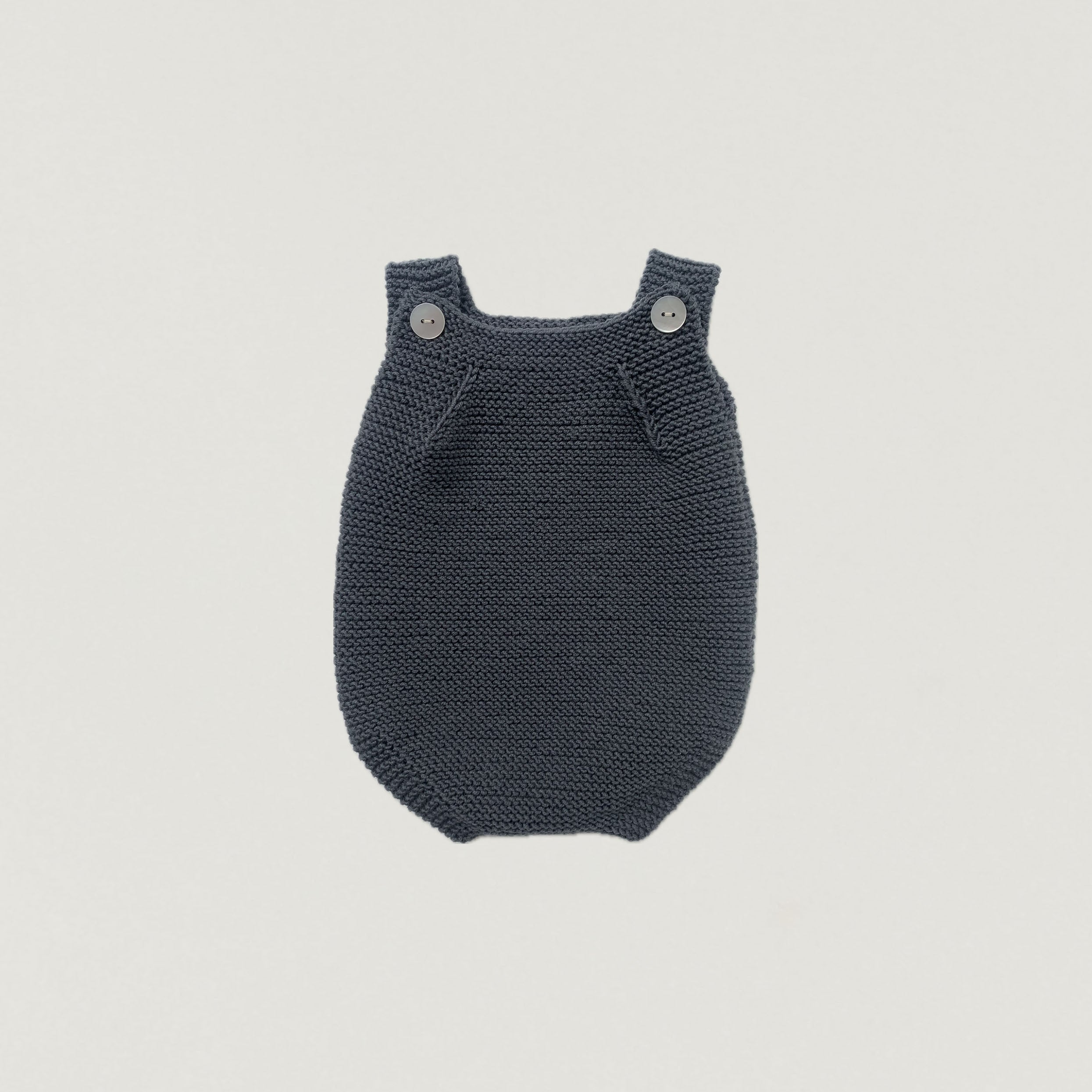 Handgestrickter Romper aus Wolle in Auslauffarben